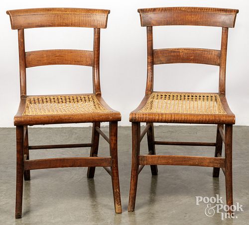 Pair of tiger maple sabre leg chairs, 19th c.