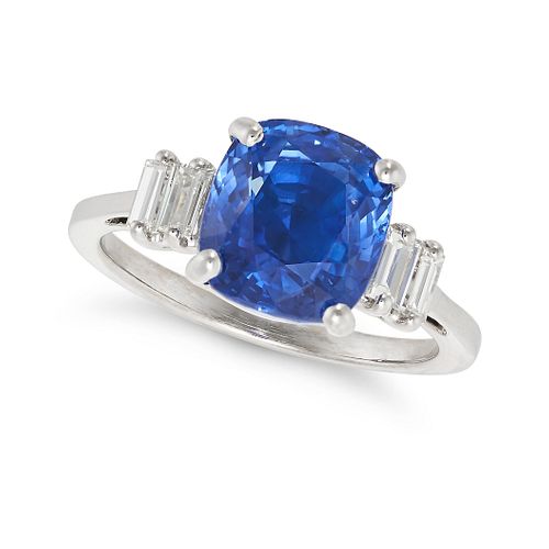 A SAPPHIRE AND DIAMOND RING set with a cushion cut sapphire of approximately 4.19 carats, flanked...