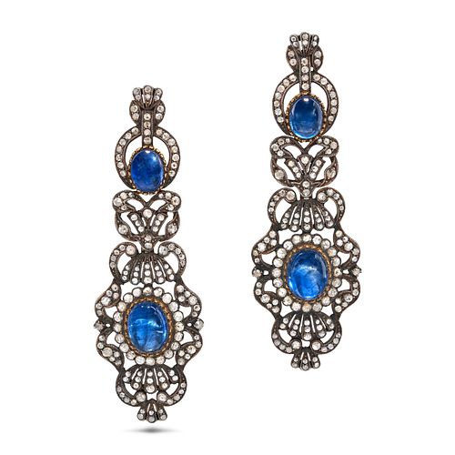 A PAIR OF SAPPHIRE AND DIAMOND DROP EARRINGS in 18ct yellow gold and silver, the tapering bodies ...