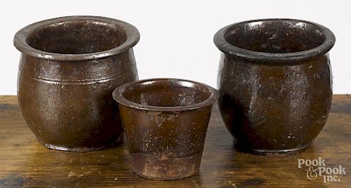 Three small redware crocks, 19th c., 2 3/4'' h., 3 3/4'' h., and 3 7/8'' h.