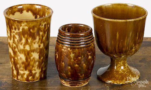 Bennington flint enamel beaker, 4 1/2'' h., together with a chalice, 4 1/2'' h., and a barrel-form cup