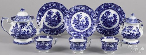 Flow blue Kyber pattern tea service, to include a teapot, 7'' h., a covered sugar, and three cups