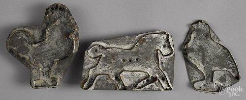 Three tin cookie cutters, to include a horse, 5 1/2'' h., 8 1/2'' w., a rooster, and a turkey.