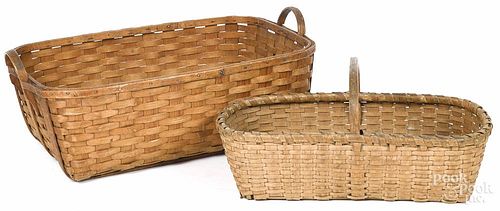 Two split oak baskets, 19th c., 11 1/2'' h., 25 1/2'' w. and 12'' h., 32'' w.