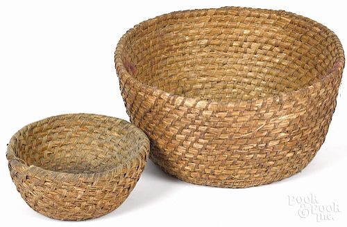 Two Pennsylvania rye straw baskets, 19th c., 9'' h., 19'' w. and 4 1/2'' h., 10 1/2'' w.