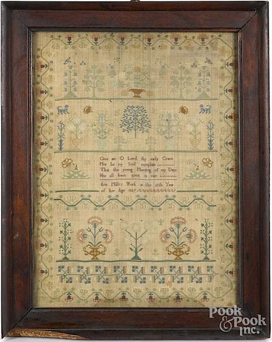 English silk on linen sampler, dated 1827, wrought by Ann Mills, 17'' x 12 1/2''.