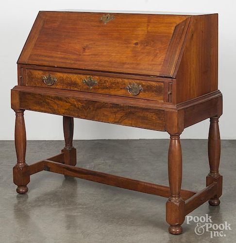 Walnut slant front desk on frame, the top 18th c., the base later, 43 1/4'' h., 44 1/2'' w.