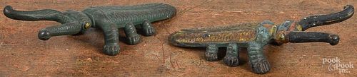 Two painted cast iron beetle boot jacks, 10'' l. and 10 1/2'' l.