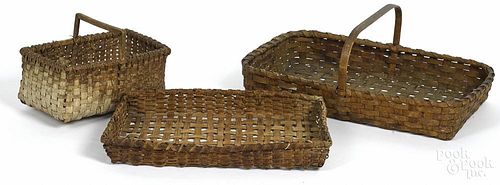 Three split oak baskets, 19th c., largest - 10'' h., 25'' w.