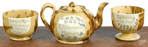 Contemporary yellowware teapot, sugar, and bowl.
