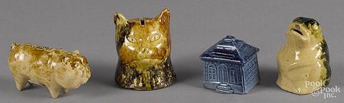 Four pottery banks, 19th c., to include a cat, 4 1/4'' h., a frog, a house, and a bulldog.