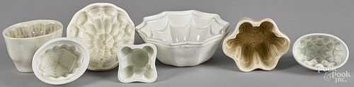 Seven ironstone and pearlware food molds, largest - 3'' h., 8 1/2'' w.