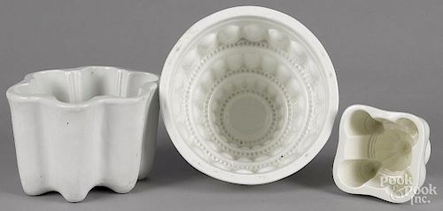 Three ironstone and pearlware food molds, largest - 7'' h., 8 1/4'' dia.