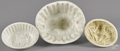 Three animal-form food molds, to include a lion, a frog, and a stag, largest - 5 1/2'' h., 7 1/2'' w.