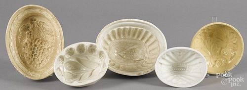 Seven assorted food molds, to include a grape bunch, corn, etc. largest - 4 1/4'' h., 7 1/2'' w.