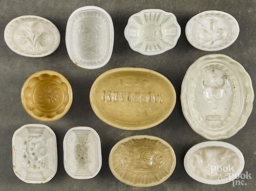 Eleven assorted food molds, to include an urn, Centennial, beehive, etc., largest - 2'' h., 5 1/4'' w.