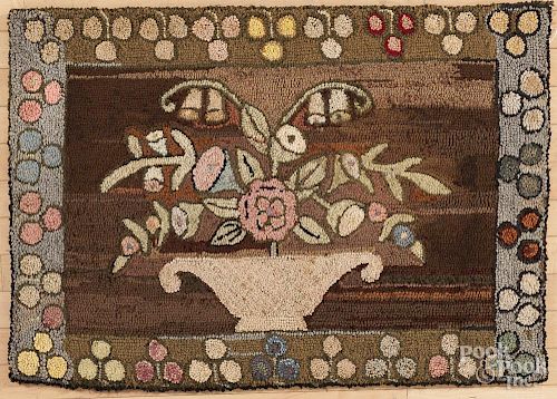 American hooked rug with a basket of flowers, 26'' x 39''.
