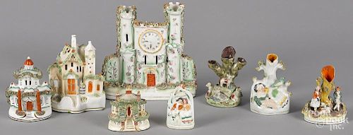 Eight pieces of Staffordshire, to include a castle, 8 1/4'' h., spill vases, pastille burners, etc.