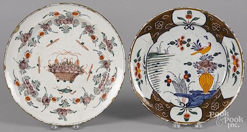 Two Delft polychrome chargers, 18th c., 12'' dia. and 12 1/2'' dia.