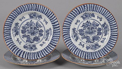 Set of four Delft blue and white plates, 18th c., 9'' dia.