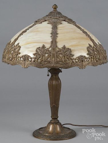 Gilt metal table lamp, early 20th c., with a slag glass shade, 23'' h.