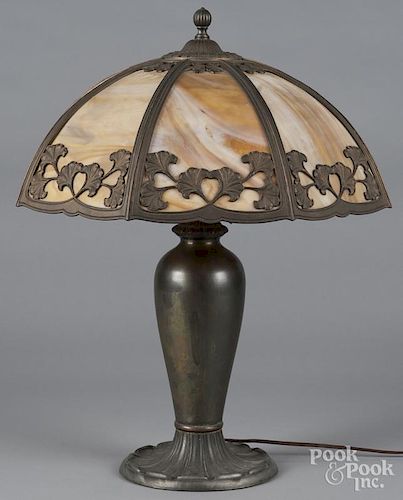 White metal table lamp, early 20th c., with a slag glass shade, 24 1/2'' h.