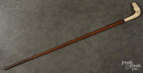 Sword cane with a celluloid horse head grip, blade with bluing and engraving, 34 1/4'' l.