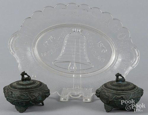 American Centennial glass platter, 9 1/2'' l., 13'' w., together with a pair of bronze covered jars