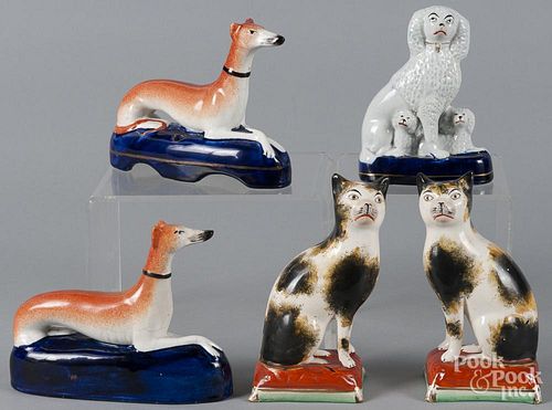 Pair of Staffordshire cats, together with a pair of whippets and a spaniel with young, tallest - 7''.