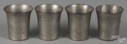 Set of four American pewter beakers, 19th c., probably New England, 3 1/8'' h.