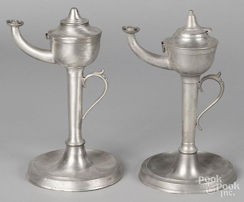Two Cincinnati pewter oil lamps, 19th c., one bearing the touch of Homan & Co., 9 1/2'' h.