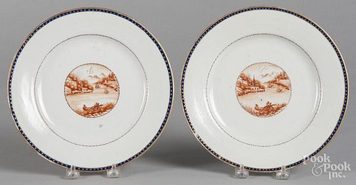 Pair of Chinese export porcelain plates, 19th c., with river landscape vignettes, 9 1/8'' dia.