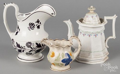 Staffordshire pitcher, 19th c., with mulberry floral decoration, together with an ironstone teapot