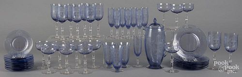 Etched amethyst glass stemware and luncheon set, fifty pieces.