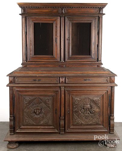 Renaissance style carved walnut two-part cupboard, late 19th c., 87'' h., 63'' w.