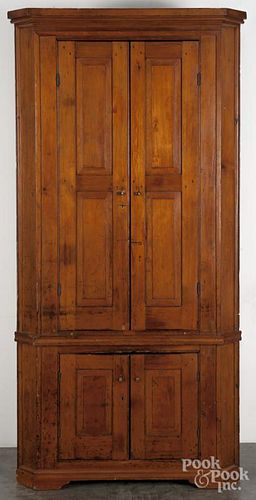 Pennsylvania pine one-piece corner cupboard, early 19th c., 86'' h., 40'' w.