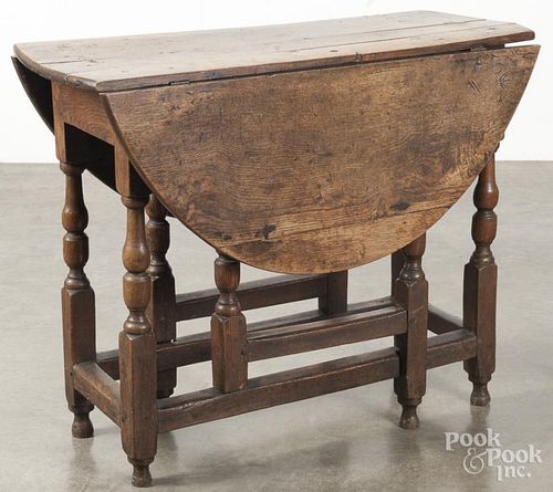 George I oak gateleg table, early 18th c., 27'' h., 14 1/2'' w., 34 1/2'' d.