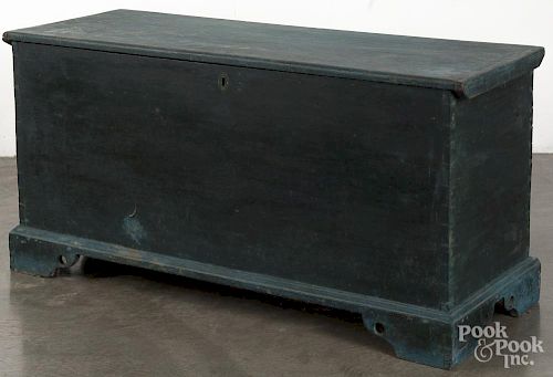 Painted pine blanket chest, 19th c., retaining a later blue surface, 24'' h., 46 1/2'' w.