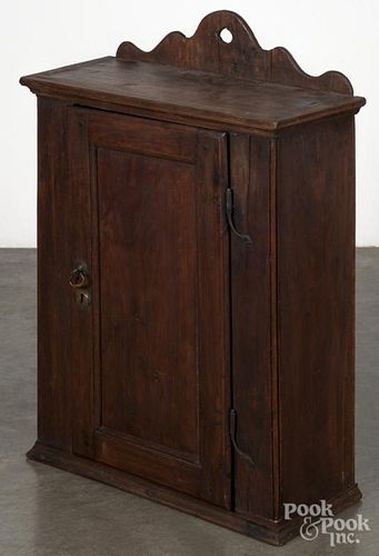Pennsylvania walnut hanging cupboard, ca. 1800, with its original rattail hinges, 33 3/4'' h., 22'' w.