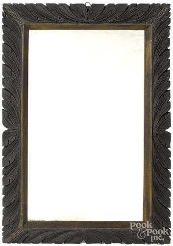 Carved pine frame with a mirror insert, ca. 1900, 29 1/2'' x 20''.