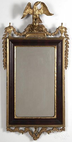 Empire mahogany and giltwood mirror, mid 19th c., with an eagle crest, 63'' h.