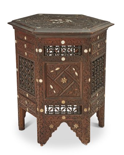 A North African carved wood side table