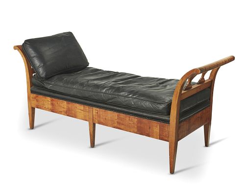 A Biedermeier burl fruitwood and leather chaise lounge