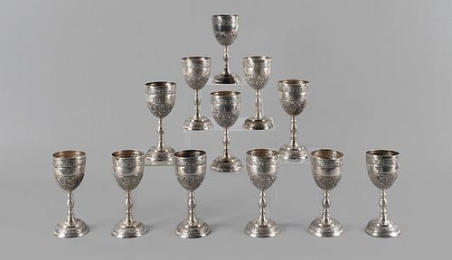 Set of twelve repoussé sterling silver goblets, st