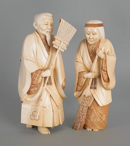 Pair of Japanese carved ivory figures of a man and