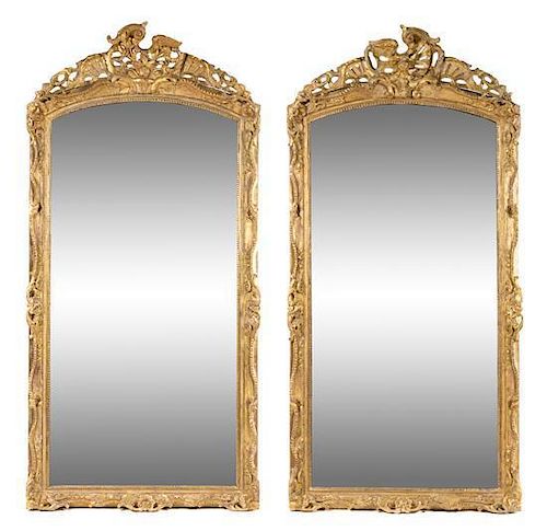 * A Pair of Rococo Style Giltwood Pier Mirrors Height 92 x width 44 1/2 inches.