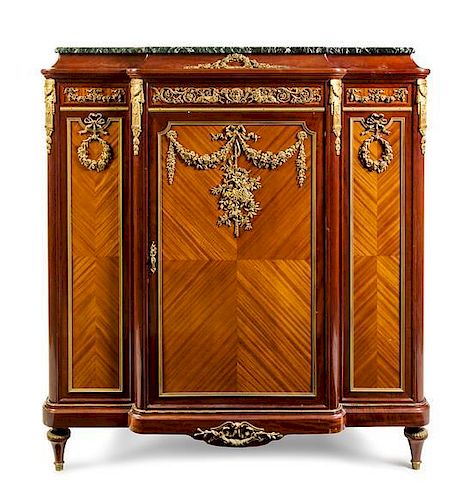 A Louis XVI Style Gilt Bronze Mounted Satinwood and Mahogany Cabinet Height 56 x width 52 1/8 x depth 19 3/4 inches.