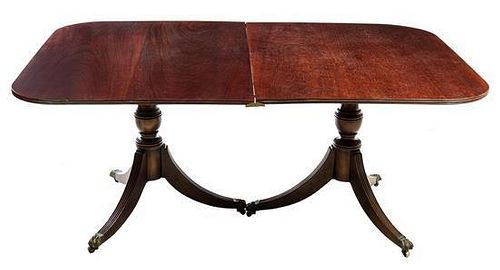 A George III Style Double Pedestal Dining Table Height 29 x width 68 3/4 x depth 47 inches.