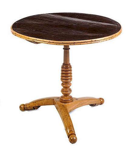 An English Elm Pedestal Table Height 25 1/2 x diameter of top 26 inches.