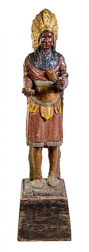 A Carved and Polychrome Painted Cigar Store Indian Height overall 71 inches.